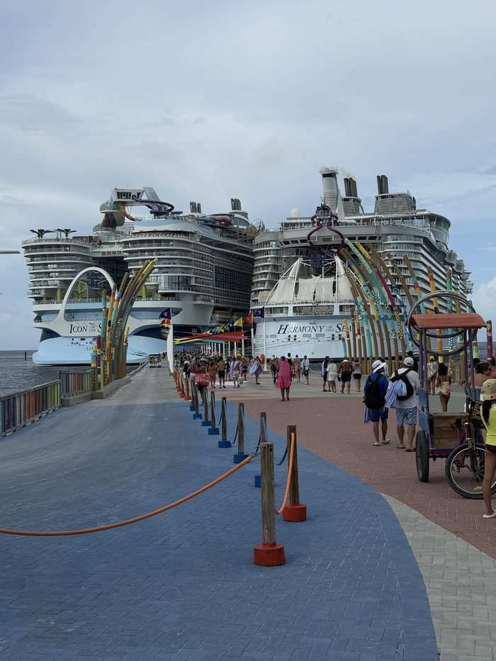 Icon of the Seas (left) and Harmony of the Seas (right) docked at the Perfect Day at CocoCay pier.