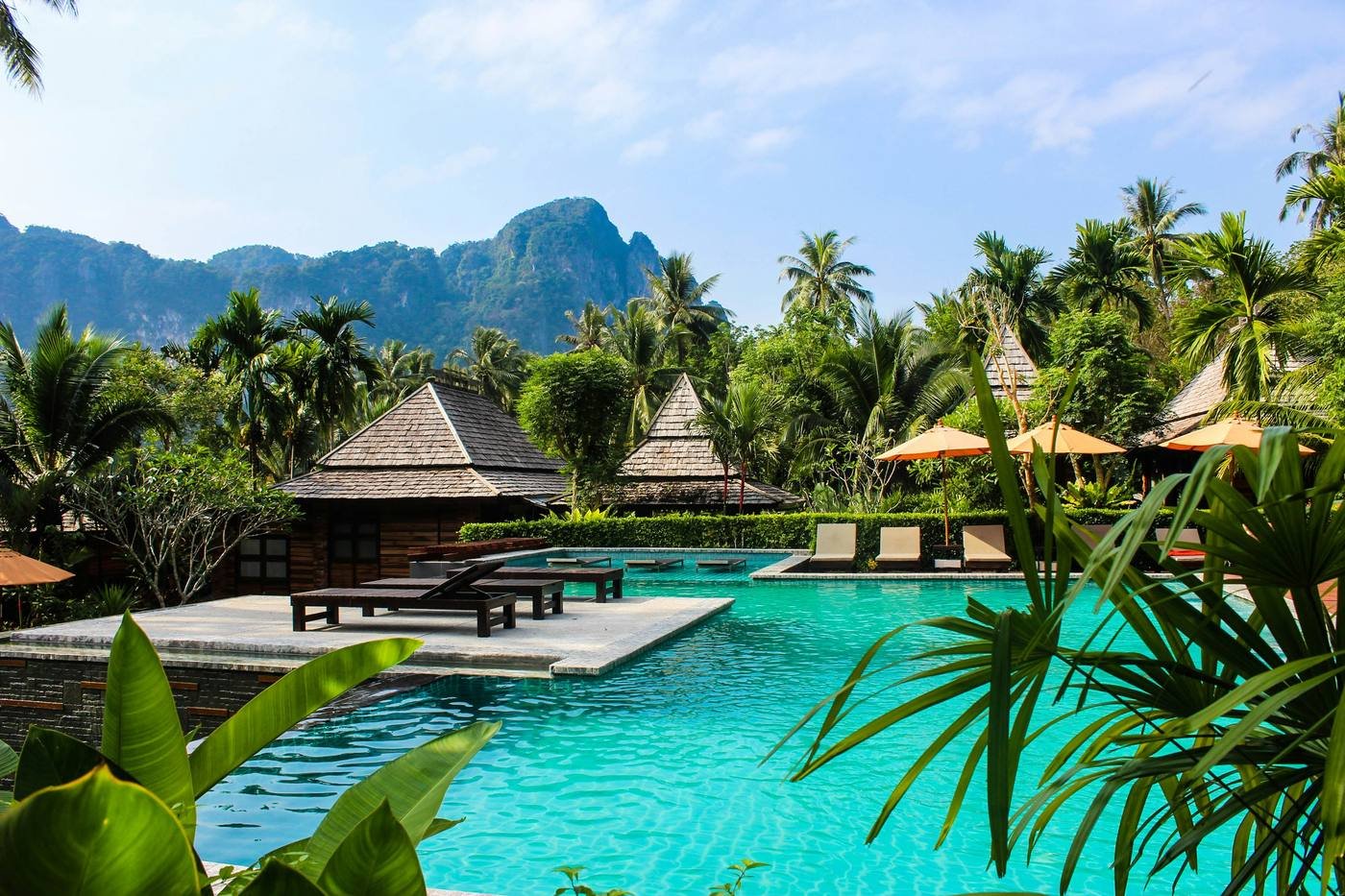 Luxury tropical resort pool with mountain views